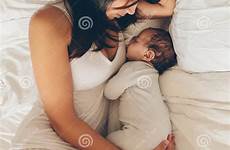 son sleeping bed mother baby boy newborn young women