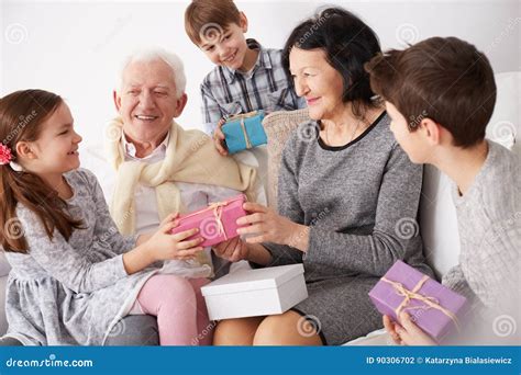 Grandparents And Grandchildren Exchanging Ts Stock Photo Image Of