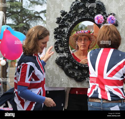 People Celebrating The Queens Diamond Jubilee At A Street Party Women