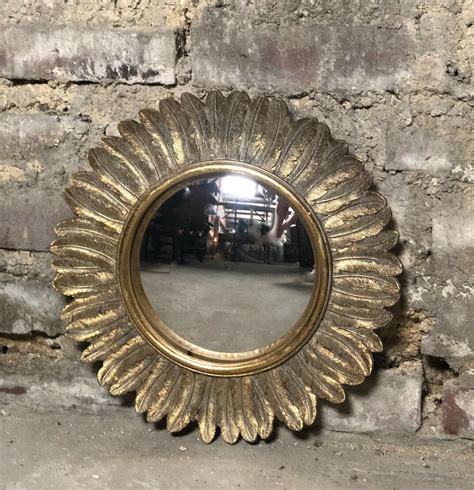 Glace / miroir plumes doré patiné avec oeil de sorcière Diam 32 cm ...