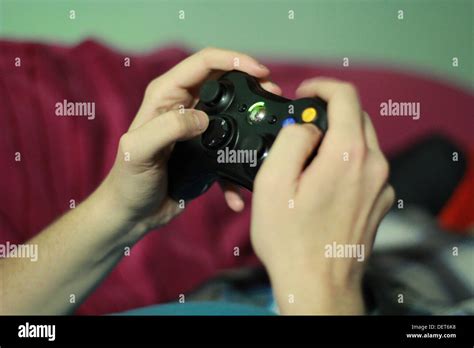 A Kid Is Playing Xbox 360 Stock Photo Alamy