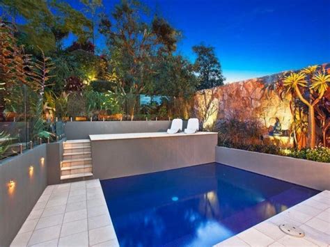 Using decorative concrete around your pool area is a durable, low maintenance, and beautiful way to achieve incredible results at a fraction of the cost for other frequently used, and costlier, materials. In-ground pool design using stone with decking ...