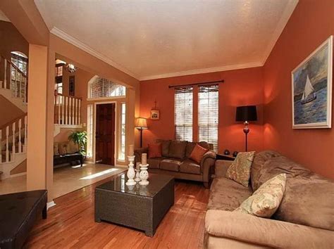 Deep Orange Wall Color With Velvet Beige Sofa Set For Small Living Room