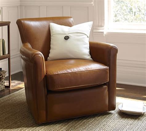 This chair with its graceful curves of metal legs and base, combines with the rugged natural beauty of top stitched leather'seat and back. Irving Roll Arm Leather Swivel Armchair | Pottery Barn