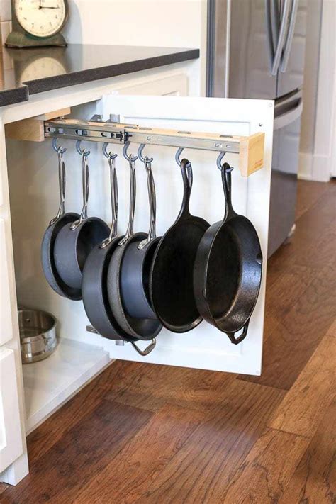 Hanging oval pan rack *see offer details. A picture of a pot hanging rack inside of a cabinet ...