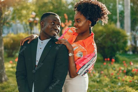 Free Photo A Young And Stylish Dark Skinned Couple Standing In A