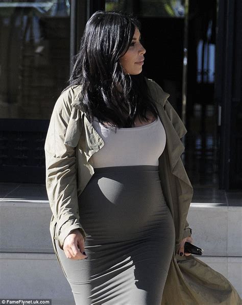Kim Kardashian Reveals Her Baby Bump As She Squeezes Into A Skintight