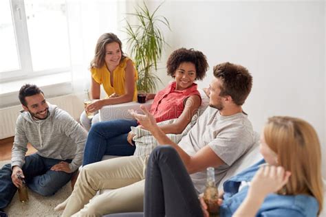 Group Of Happy Friends With Drinks Talking At Home Stock Image Image