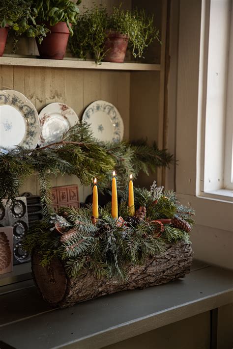 Celebrate The Winter Solstice With A Traditional Yule Log Under A Tin