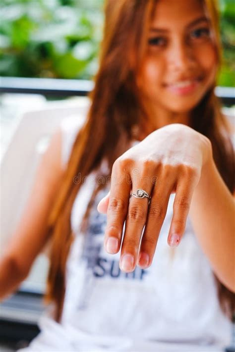 Young Beautiful Girl Showing Her Hand With The Silver Ring Stock Image