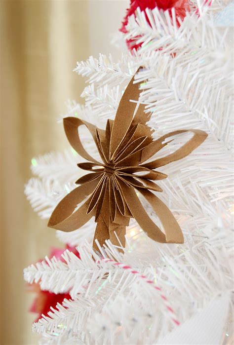 Add a unique touch to your paper snowflakes by learning how to make a snowflake. How to: 3 Elegant Tree Decorations You Can Make from ...