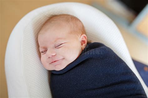 Cute Little Newborn Baby Girl Sleeping Wrapped In Blanket Stock Image