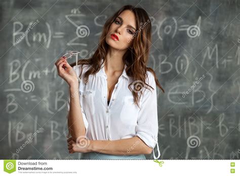 Young Female Teacher Near Blackboard In Sexual Pose Stock