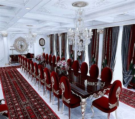 A Large Dining Room With Red Chairs And Chandelier Hanging From The