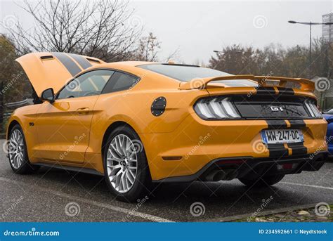Rear View Of Orange Ford Mustang Gt 50 Parked In The Street Editorial