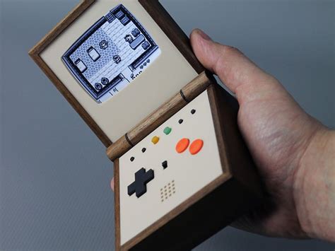 Pocket Sized Portable Game System Made From Walnut Wood By Love Hultèn