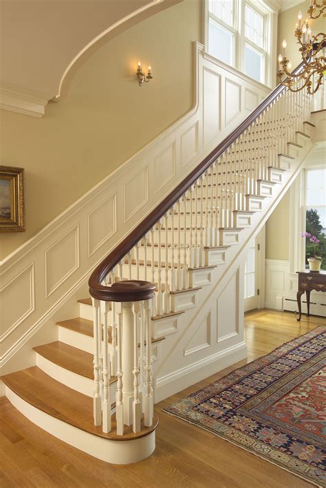 Formal Curving Staircase With Paneling Modern Staircase Traditional