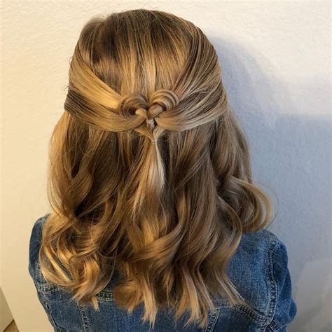 A fancy twisted half ponytail gives a glamorous touch to short hairstyles. 8 Cool Hairstyles For Little Girls That Won't Take Too Much Of Your Time | Lipstiq.com