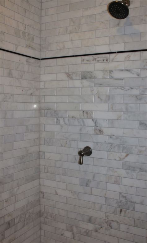 Brighten your bathroom with subway tiles, reduce excess water from sticking around, and enjoy a tile that is aesthetically pleasing and durable. Marble Subway Tile Shower Offering the Sense of Elegance ...