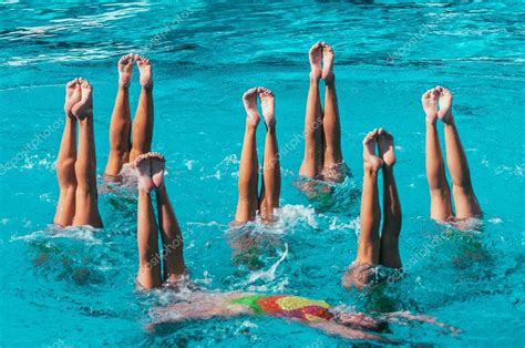 Synchronized Swimmers Performance With Legs Stock Photo By Microgen