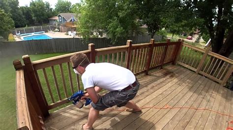 It doesn't take much pressure to spray stain. How to Repair an Old Deck | KG Landscape Management