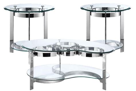 Even though the two may occupy exactly the same footprint, the wood table will have a bigger presence in the room and seem to take up more floor space. Curvy Chrome & Glass End Table at Gardner-White