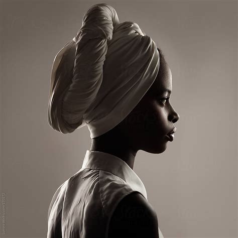 beautiful black woman with a turban by lumina stocksy united