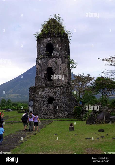 Old Bell Tower In Cagsawa In Front Of The Volcano Mayon On The