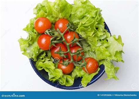 Top View Of Tomatoes And Lettuce Leaves In The Bowlfresh And Diet Food