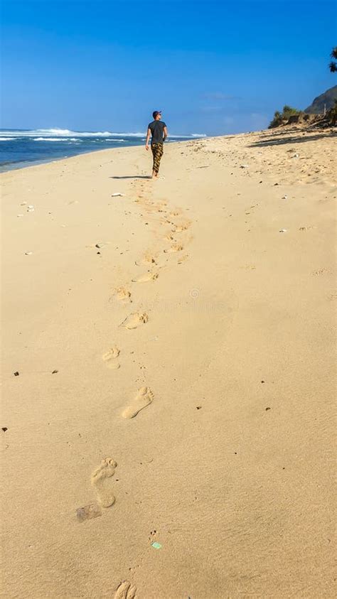 Bangli A Man Leaving Footprints On The Beach Stock Image Image Of