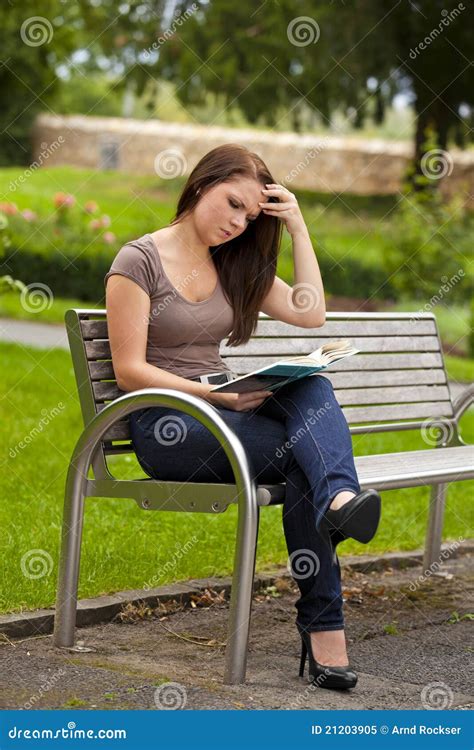 Beautiful Brunette Woman Reading A Book Royalty Free Stock Photo
