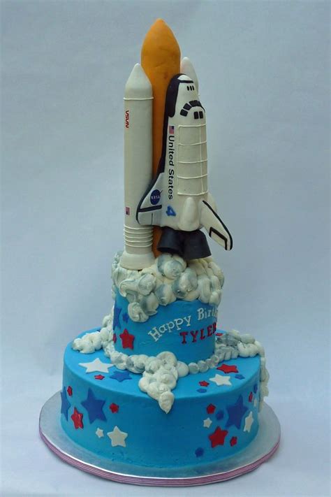 In honor of my impending move to the space coast of florida, i offer you this space themed retro rocket party with colorful wooden birthday signs, shooting star lollipops, rocket shaped crayon favors and a rocket fuel drink station! Space Shuttle cake | Rocket cake, Cake, Cupcake cakes