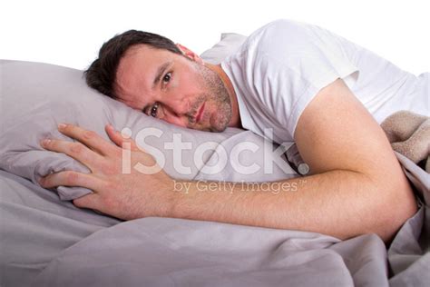 Close Up Of Male Insomniac Unable To Sleep In Bed Stock Photo Royalty