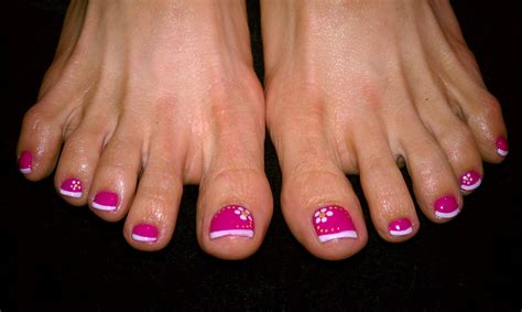 Pedicure With Pink Base And White French Tip And Flowers In Corner