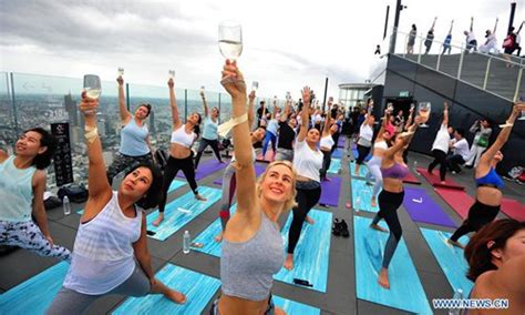 Yoga Enthusiasts Attend Sunrise Wine Yoga Class In Bangkok Global Times