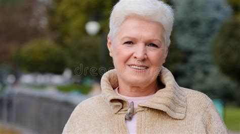 portrait calm confident adult middle aged woman pensioner granny mistress homeowner tender