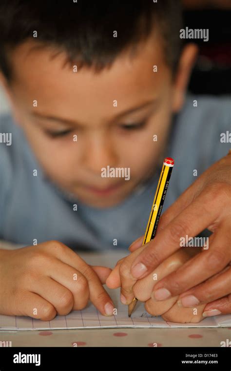 6 Year Old Boy Learning To Write Stock Photo Alamy