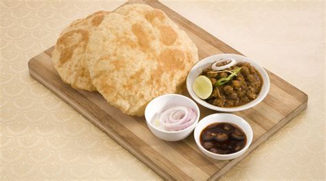 Chole bhature in hindi, punjabi chole bhature recipe, chole bhature recipe video, chole on our quest to conquer massive foods, we tried finishing the biggest chole bhature. Raksha Bandhan special: Punjabi Chole Bhature