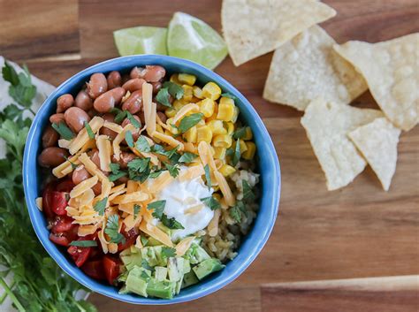 Our inspired burrito bowl version skips the tortilla and loads up on all the fillings instead! Fresh Brown Rice Burrito Bowls - My Frugal Adventures