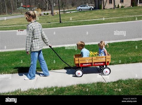 Children Pushing Pulling Wagon Hi Res Stock Photography And Images Alamy