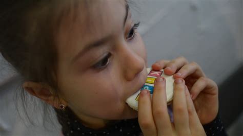 Girl Eating Shy Gingerbread Cookies Close Up Stock Video Footage 00