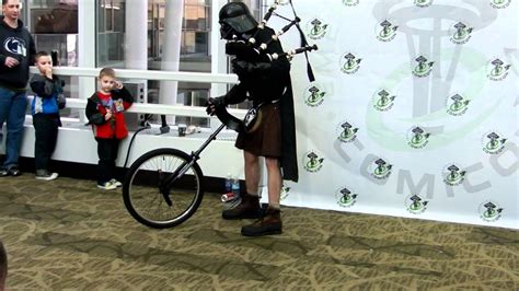 Darth Vader In A Kilt On A Unicyle Playing The Starwars Theme On