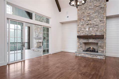 Vaulted ceilings bring a sense of openness to a home. Custom Home Builder | Ship lap walls, Stone fireplace wall ...