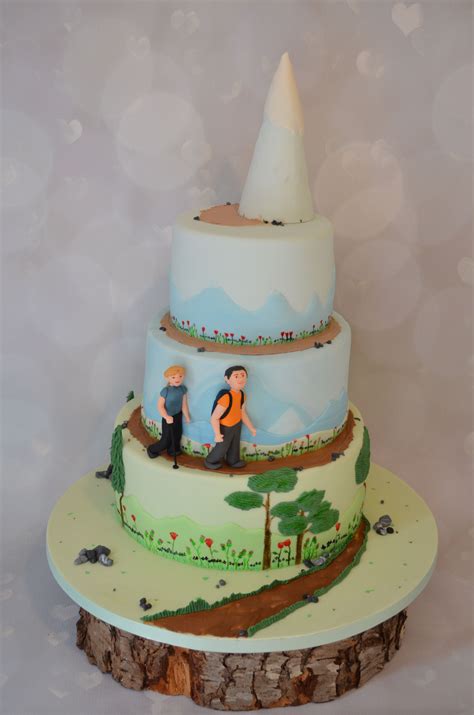 Hiking Themed Wedding Cake Sat On A Wooden Log Hand Painted Flowers