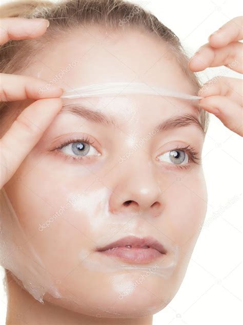 Woman In Facial Peel Off Mask Stock Photo By ©voyagerix 50676383