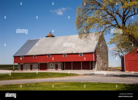 Historic Stone Barn And Blue Sky Amish Farm Scene In The Amish