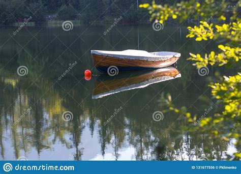 Alone Wooden Boat On Lake Stock Photo Image Of Peaceful 131677556