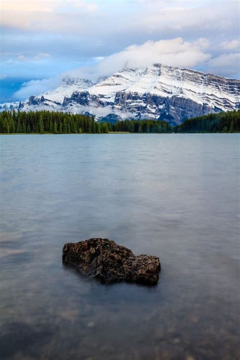 Picturesque Two Jack Lake Surrounded By Majestic Snowy Mountains And
