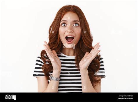 Surprised Enthusiastic Cute Ginger Girl In Striped T Shirt Hearing Excellent News Open Mouth