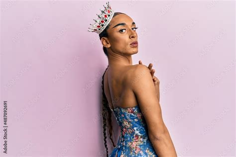 Sensual Hispanic Transgender Woman Wearing Queen Crown And Posing Glamorous With Seductive Face